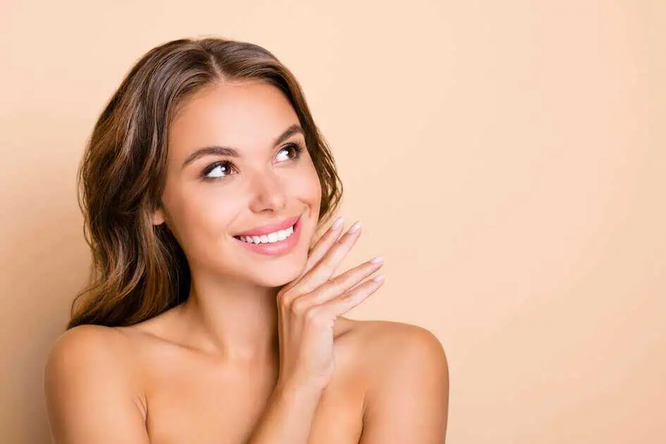 Woman with healthy glowing skin and smooth hair